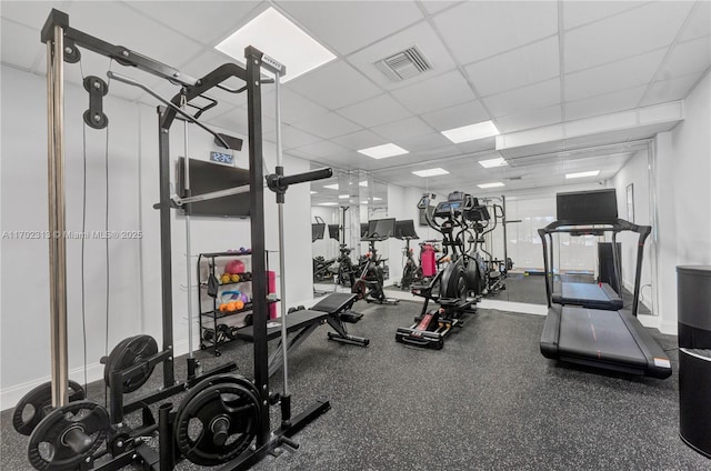 workout area featuring a drop ceiling