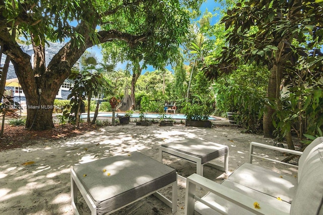 view of patio with a swimming pool