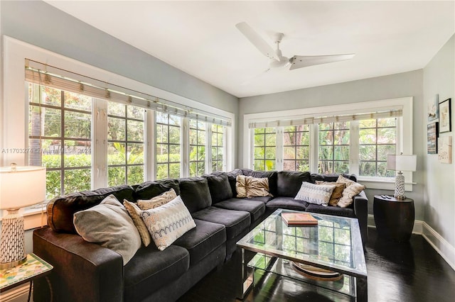 sunroom / solarium featuring ceiling fan