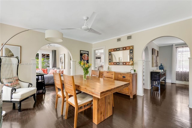 dining room featuring dark hardwood / wood-style floors and ornamental molding