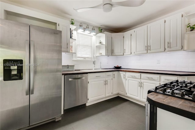 kitchen with white cabinetry, sink, ceiling fan, and appliances with stainless steel finishes