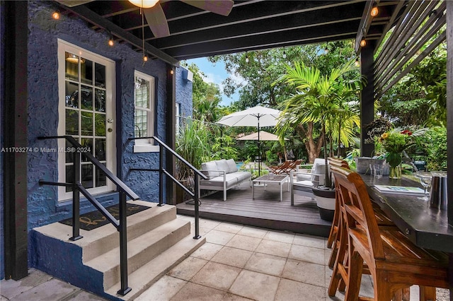 deck with ceiling fan and an outdoor hangout area