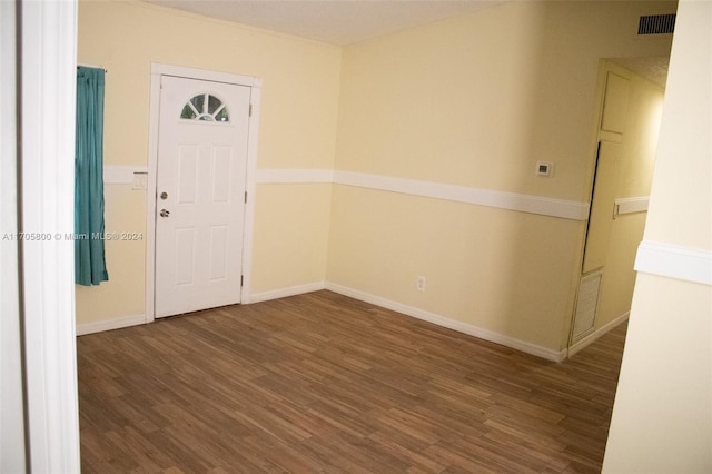 spare room featuring dark hardwood / wood-style flooring