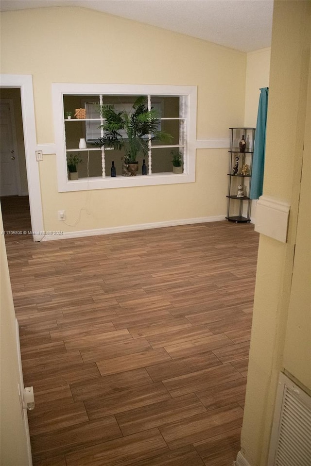 unfurnished room featuring dark hardwood / wood-style floors