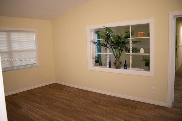 spare room with dark hardwood / wood-style flooring