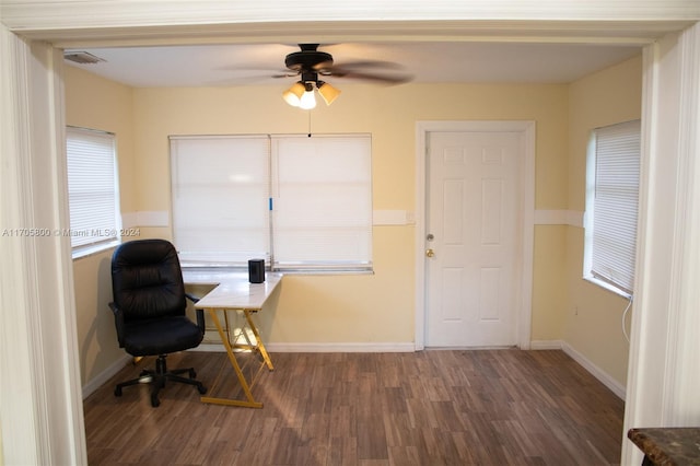 home office with ceiling fan and dark wood-type flooring