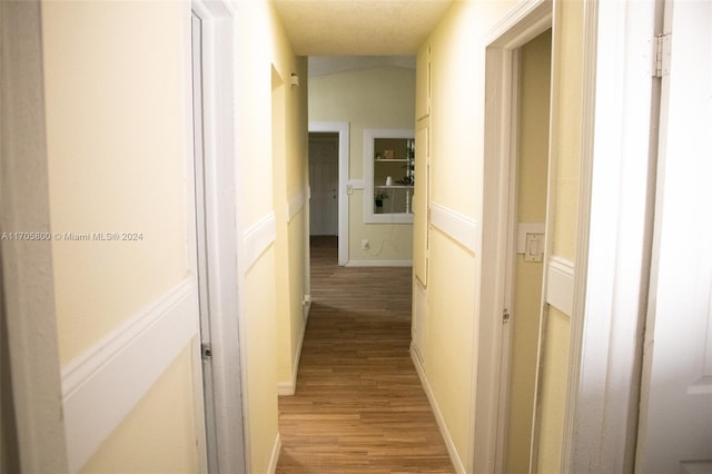 hall with light hardwood / wood-style flooring