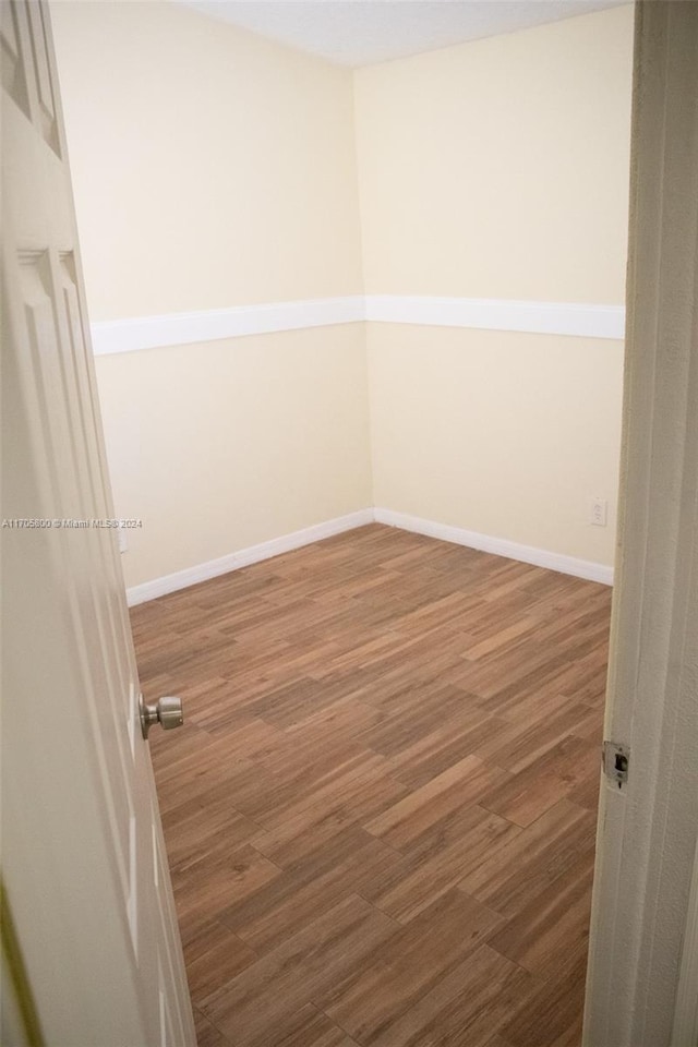 spare room with hardwood / wood-style flooring