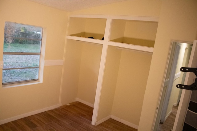 mudroom featuring wood-type flooring and a textured ceiling