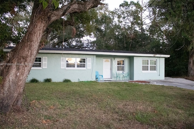 ranch-style home with a front yard