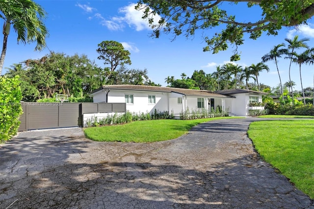 ranch-style home with a front yard