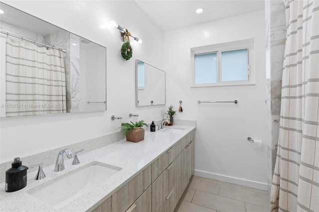 bathroom with a shower with shower curtain, vanity, and tile patterned floors