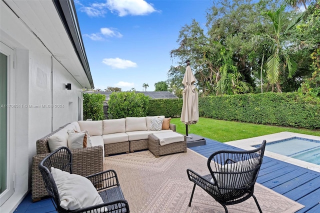 view of patio / terrace with outdoor lounge area and a swimming pool side deck