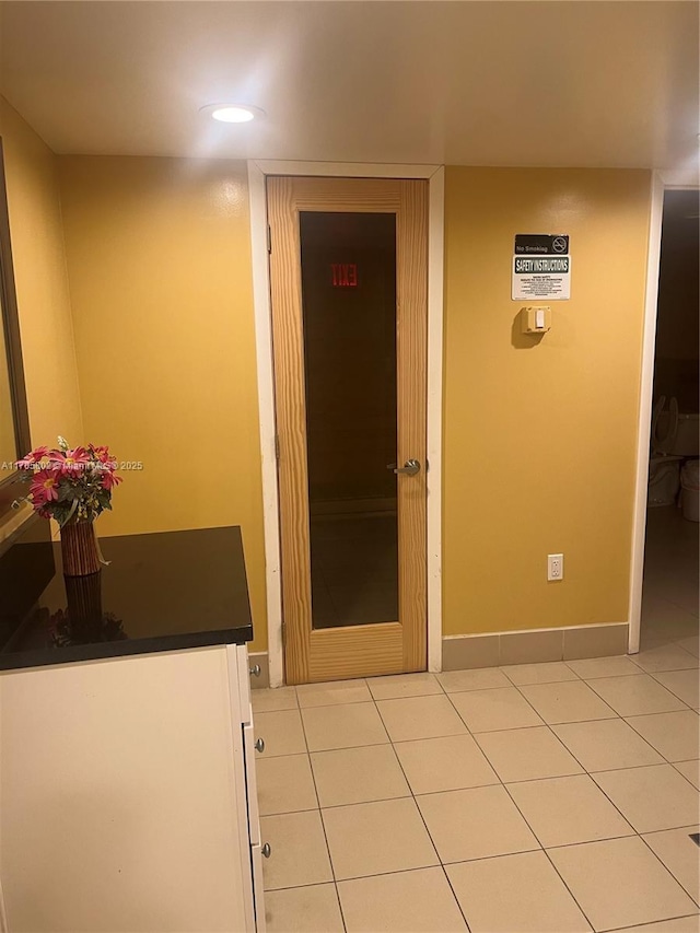 interior space with light tile patterned floors