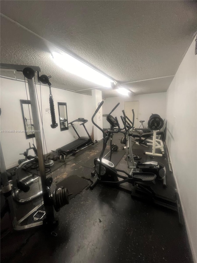 workout area with a textured ceiling