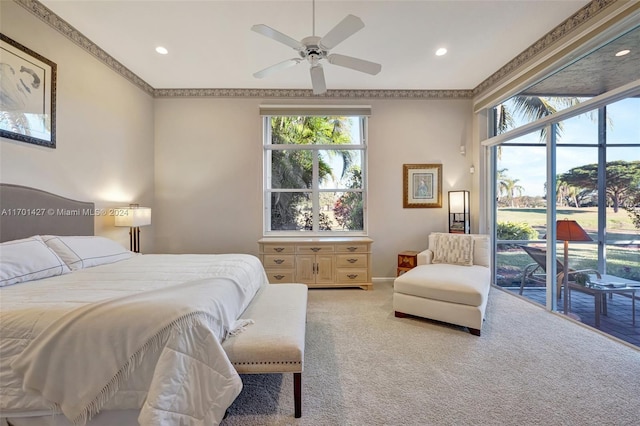 carpeted bedroom with ceiling fan, access to exterior, and ornamental molding