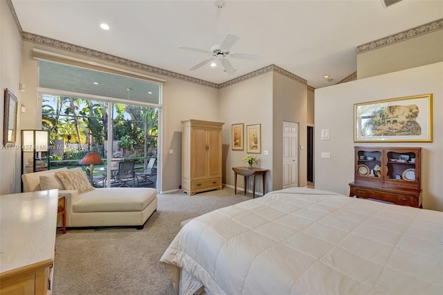 carpeted bedroom featuring ceiling fan, access to exterior, and a high ceiling