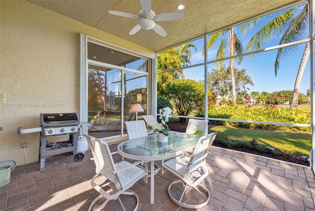 sunroom / solarium with ceiling fan