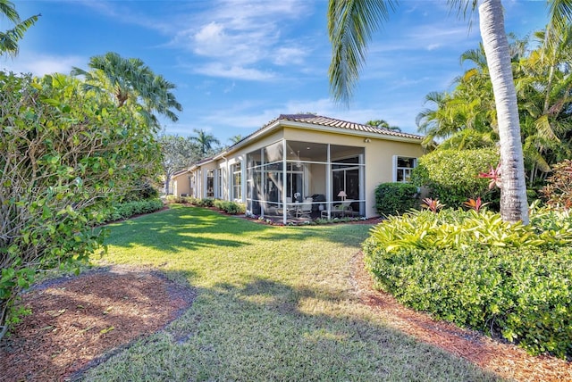 view of yard with a sunroom