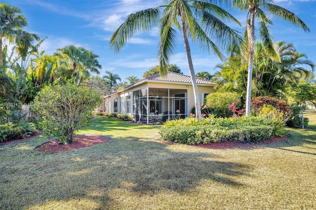 view of yard featuring a sunroom