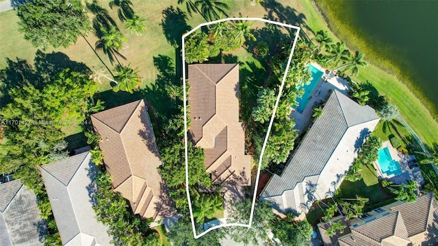 birds eye view of property with a water view