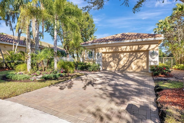 mediterranean / spanish house with a garage