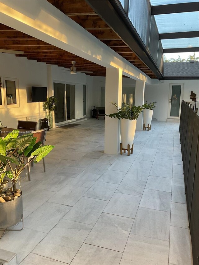 hall with tile patterned flooring