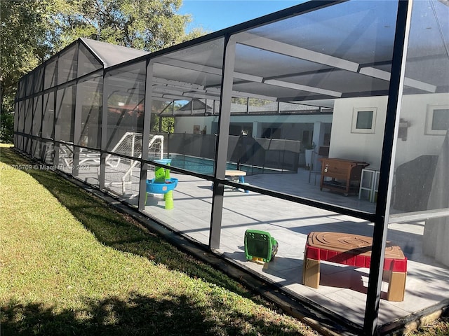 exterior space with a lawn, a patio area, and a lanai