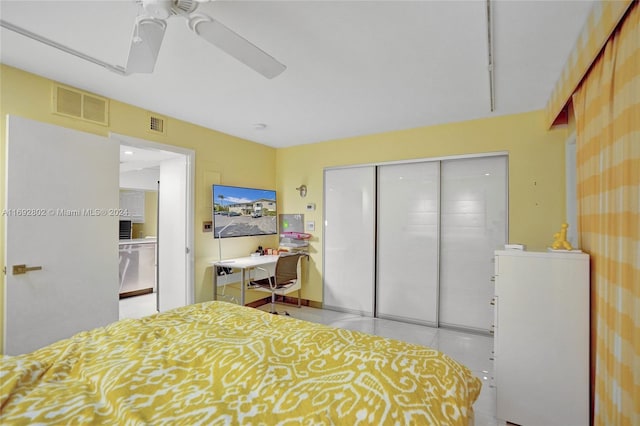 bedroom with ceiling fan and a closet