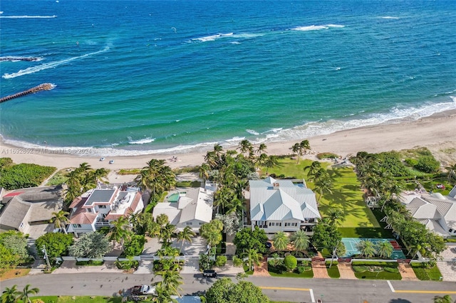 aerial view with a water view and a beach view