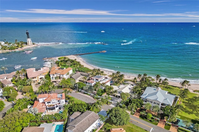 drone / aerial view with a water view and a view of the beach