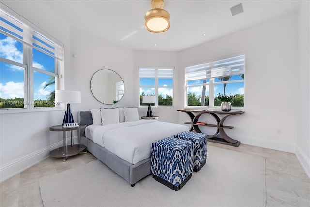 bedroom featuring multiple windows