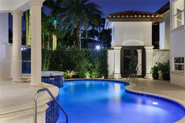 view of swimming pool with an in ground hot tub and a patio