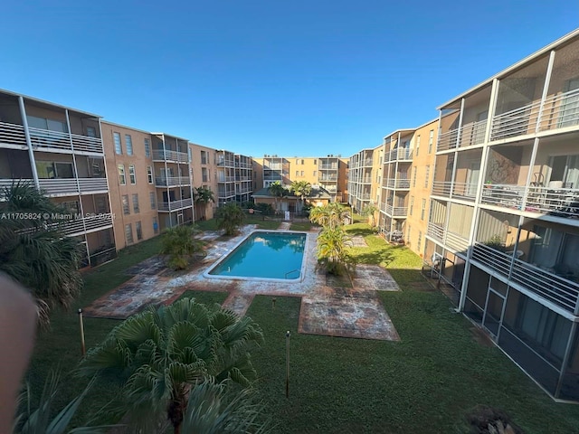 view of swimming pool with a patio area