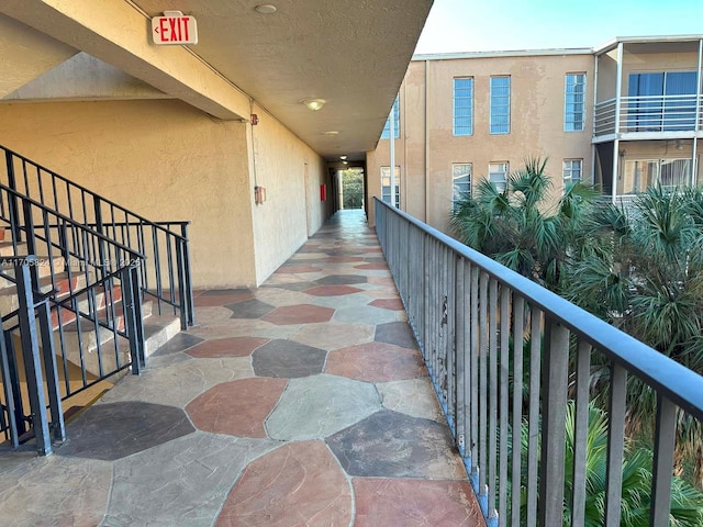 corridor featuring stairway