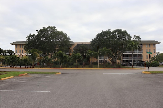 view of property with uncovered parking