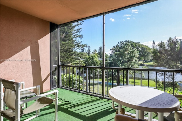 balcony featuring a water view