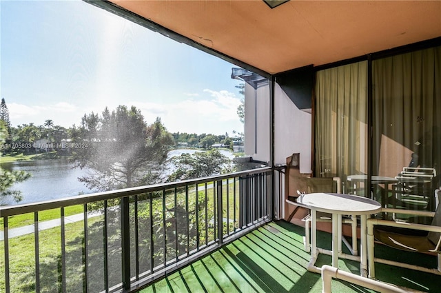 balcony featuring a water view