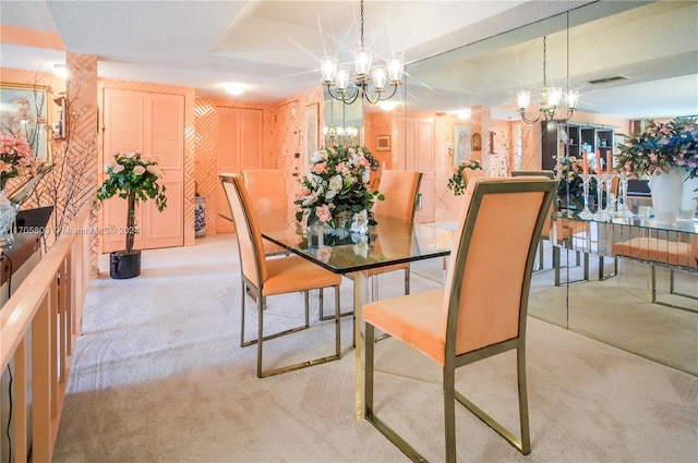 dining space featuring light colored carpet and a notable chandelier