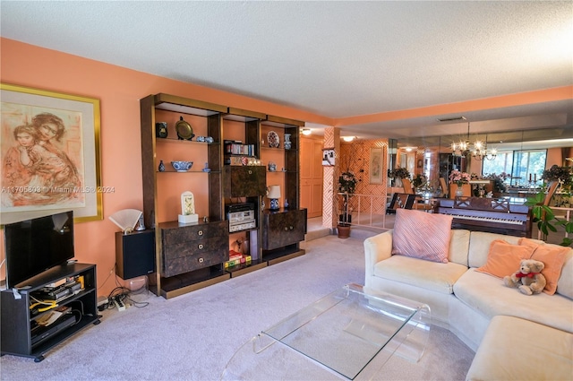 living room featuring carpet, a textured ceiling, and an inviting chandelier