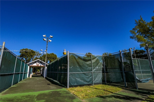 exterior space with tennis court