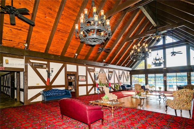 living room with ceiling fan with notable chandelier, beam ceiling, wood-type flooring, and high vaulted ceiling