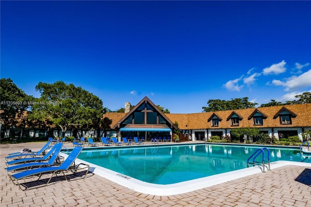 view of swimming pool featuring a patio