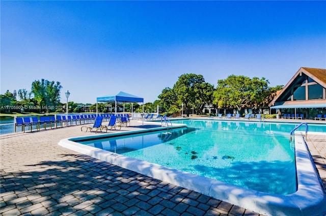 view of swimming pool with a patio