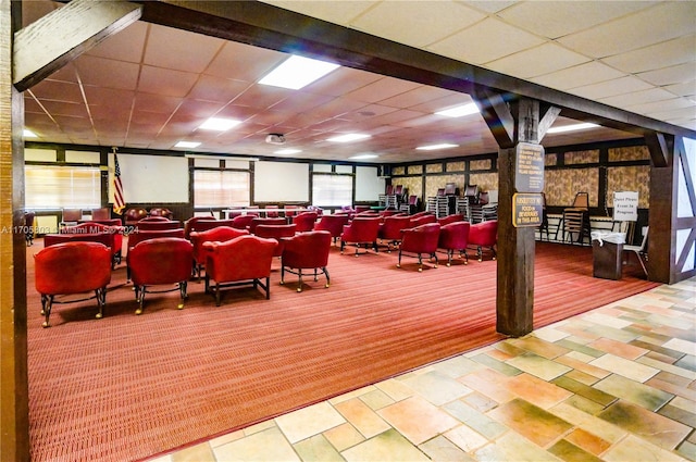 home theater room featuring a drop ceiling