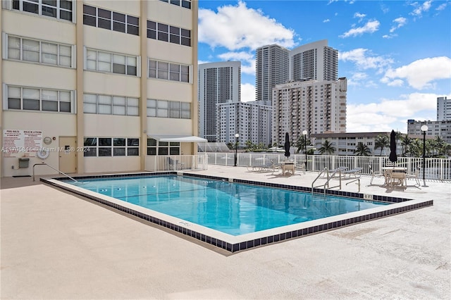 view of pool featuring a patio