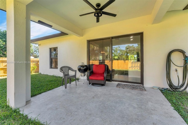 view of patio / terrace featuring ceiling fan