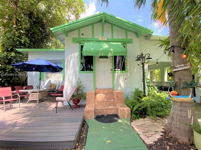 doorway to property with a deck