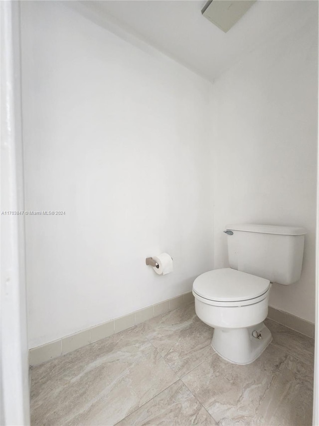 bathroom featuring toilet