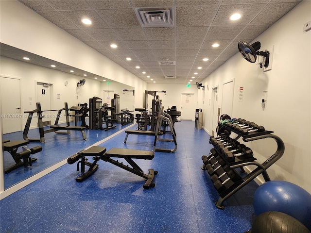 exercise room with a drop ceiling